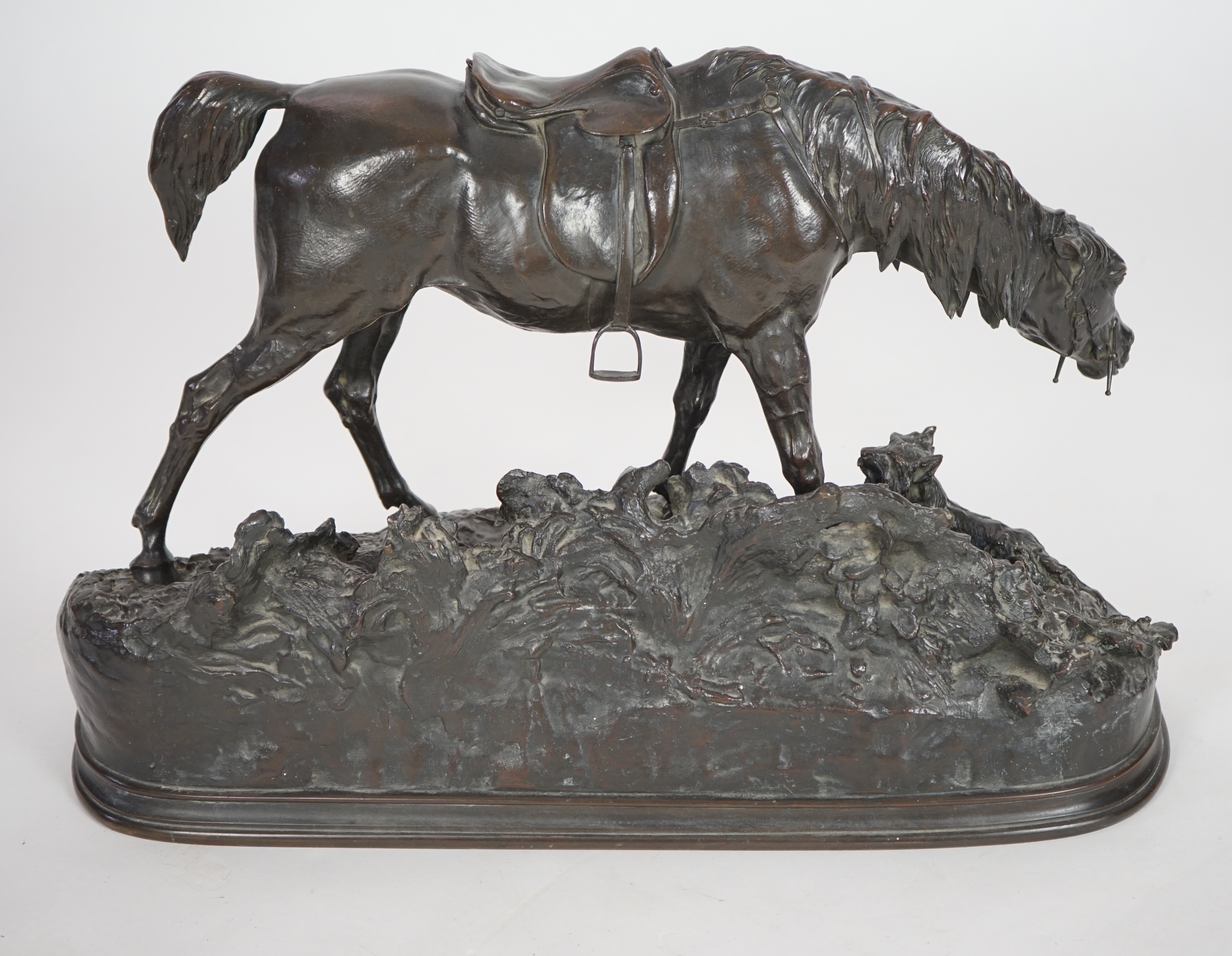 Pierre Jules Mène (French, 1810-1879). A bronze group of a saddled horse standing upon a mound with a terrier at its feet, width 69cm, height 43cm